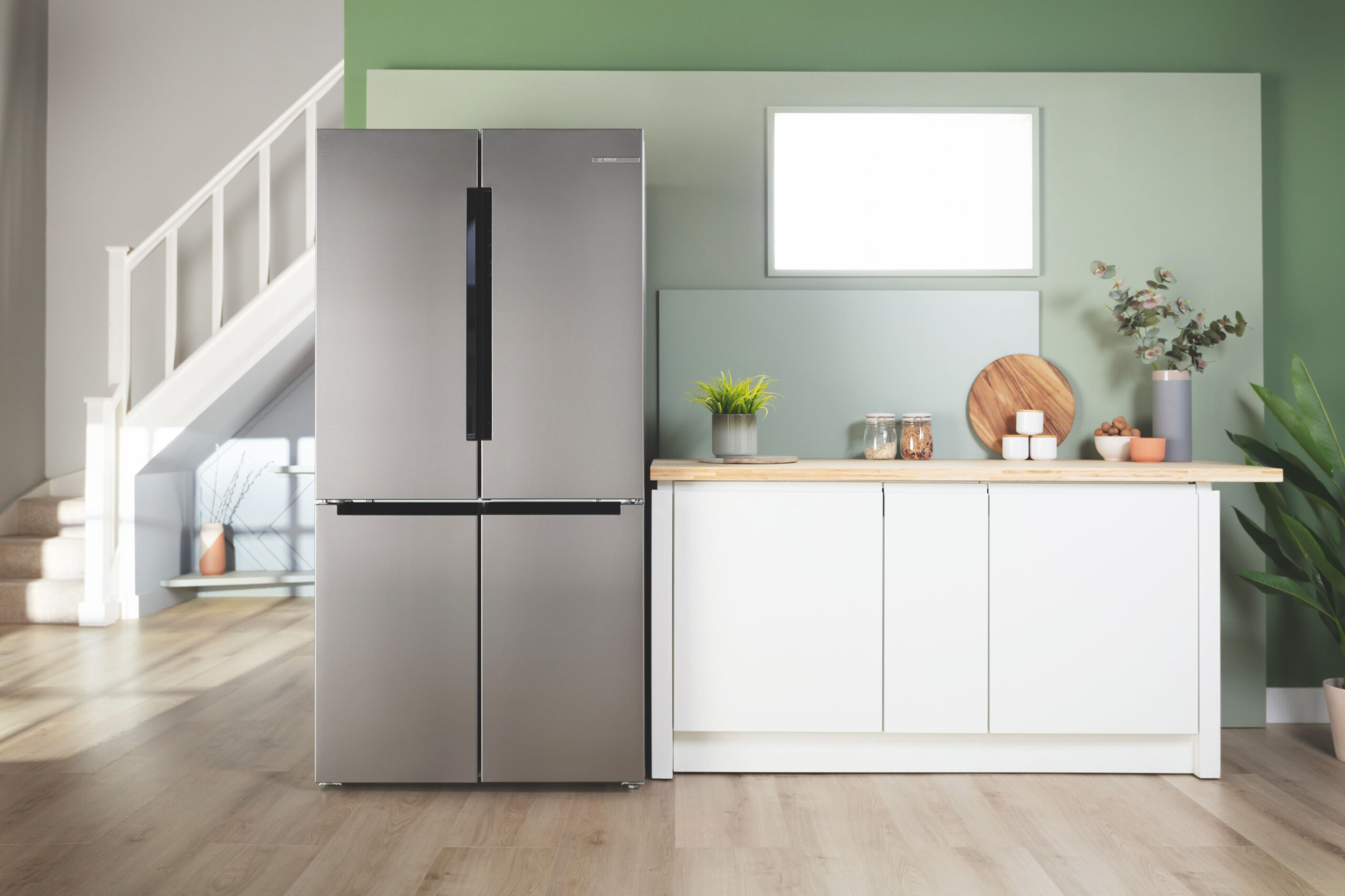 Modern energy-efficient refrigerator in a bright kitchen